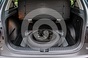 Spare wheel in the trunk of a modern car.