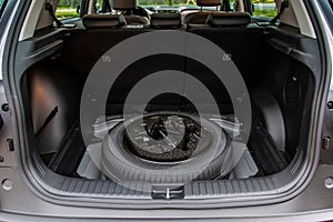 Spare wheel in the trunk of a modern car.