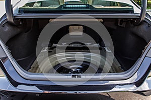 Spare wheel in the trunk of a modern car.