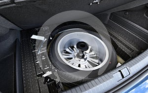 Spare wheel in the trunk of a modern car