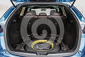 Spare wheel in the trunk of a modern car.