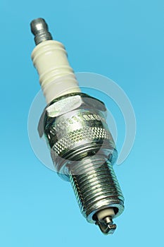 Spark plug on blue