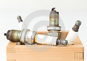 Spark plug in wood box