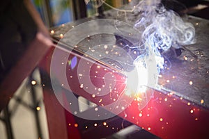 The sparking light from the arc welding process