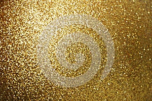 Sparkle glowing dark gold glitter of carborundum abstract textured background, can use for celebrate christmas day, new year day photo