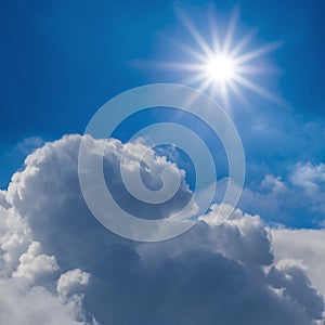 sparkle sun above a dense cumulus clouds