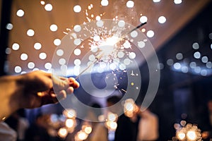 sparkler burns in hand.happy new year 2022 photo