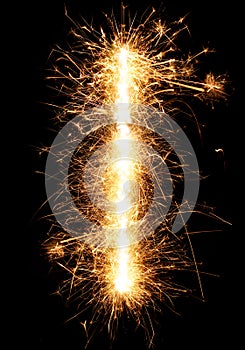 Sparkler firework light alphabet I on black photo