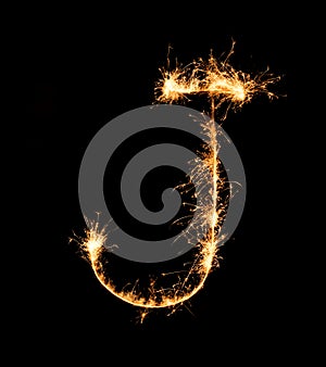 Sparkler firework light alphabet J (Capital Letters) at night