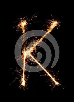 Sparkler firework light alphabet K (Capital Letters) at night