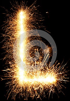 Sparkler firework light alphabet L on black