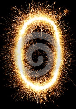 Sparkler firework light alphabet O and number zero isolated on black
