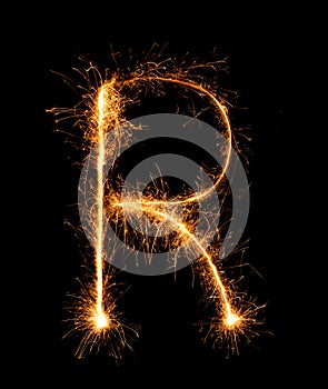 Sparkler firework light alphabet R (Capital Letters) at night