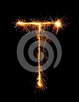 Sparkler firework light alphabet T (Capital Letters) at night