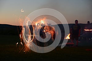 Sparkler fun at a family summer campfire