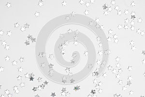 Sparkles silver stars on white background with text place- Image