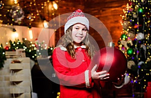 Sparkling big toy. Merry christmas. Festive atmosphere christmas day. Girl santa claus costume hold big ball christmas