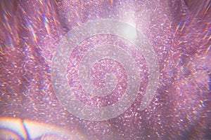 Sparkling bokeh background in a fresh pink color. pink sequins flares background defocus