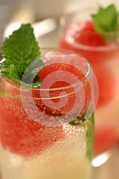 Sparkling cocktail with watermelon and melon ball-shaped pieces