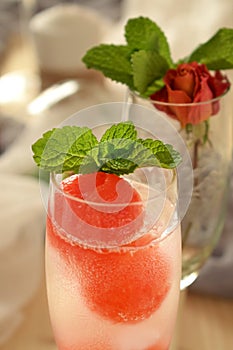 Sparkling cocktail with watermelon and melon ball-shaped pieces