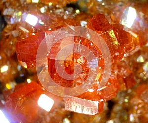 Sparkling cog like crystals of vanadinite