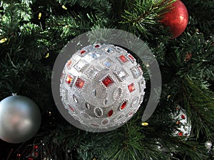 Sparkling crystal beaded silver ball hanging on Christmas tree