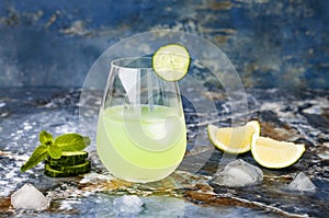 Sparkling cucumber mint gin and tonic fizz with aloe vera on marble table. Copy space. photo