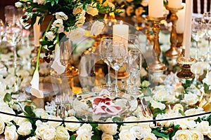 Sparkling glassware stands on table prepared for elegant wedding