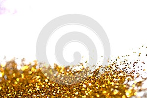 Sparkling Glitter on White Background Bokeh Abstract Close Up Gold