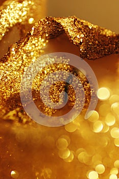 Sparkling gold glitter and bokeh background