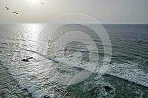 Sparkling  ocean waves approaching coastline. Beautiful nature background