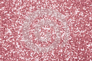 Sparkling pink, rose sequin textile background. Fashion fabric glitter, sequins