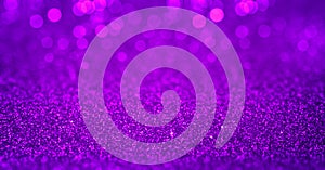 Sparkling purple magenta glitter background with bokeh. Closeup view, dof. Pattern with shining fine purple sequins. Festive