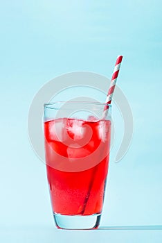 Sparkling red color drinks with water soda and ice in glass