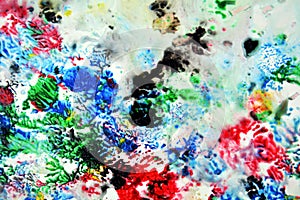 Sparkling red green black blue pink colors and hues. Abstract wet paint background. Painting spots.