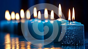 Sparkling row of diverse candles lighting up a blue setting Happy birthday card idea