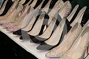 Sparkling row of rhinestone high heel shoes