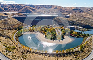 Sparkling water below Luck Peak Dam in Idaho with autumn trees