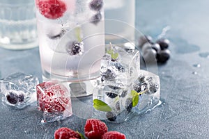 Sparkling water with berry and herb ice