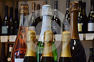 sparkling wine bottles in wine store and ready for home delivery