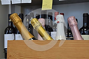 Sparkling wine bottles in wine store and ready for home delivery, restaurant, cafe, bar