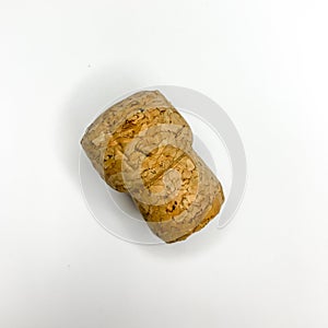 Sparkling wine champagne cork on white background close up