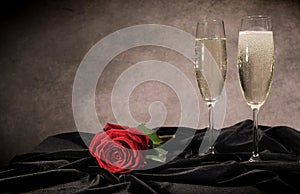 Sparkling wine and red roses in close-up