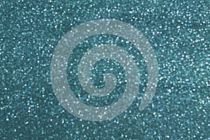 Sparkly glitter, turquoise background bokeh effect photo