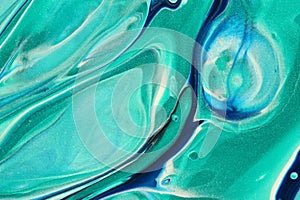 Sparkly teal and classic blue swirl with white to create this abstract background.