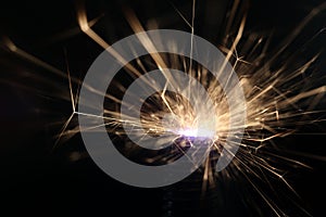 Sparks on a black background electric short circuit