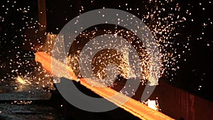 Sparks from the cutting of the red-hot billet circular saw