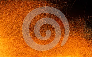 Sparks of fire on a black. Abstract background with fire sparks