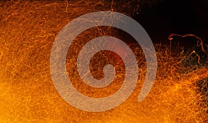 Sparks of fire on a black. Abstract background with fire sparks
