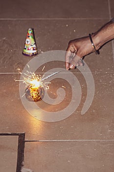 Sparks of the fire coming out of the sparkler to burn the crackers during the festivals, celebration, diwali christmas